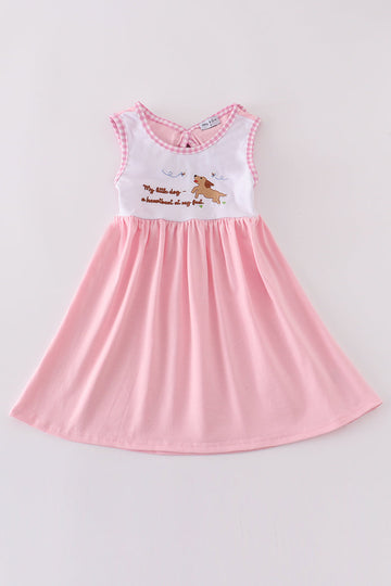 A charming pink dress with adorable puppy embroidery, perfect for little girls.