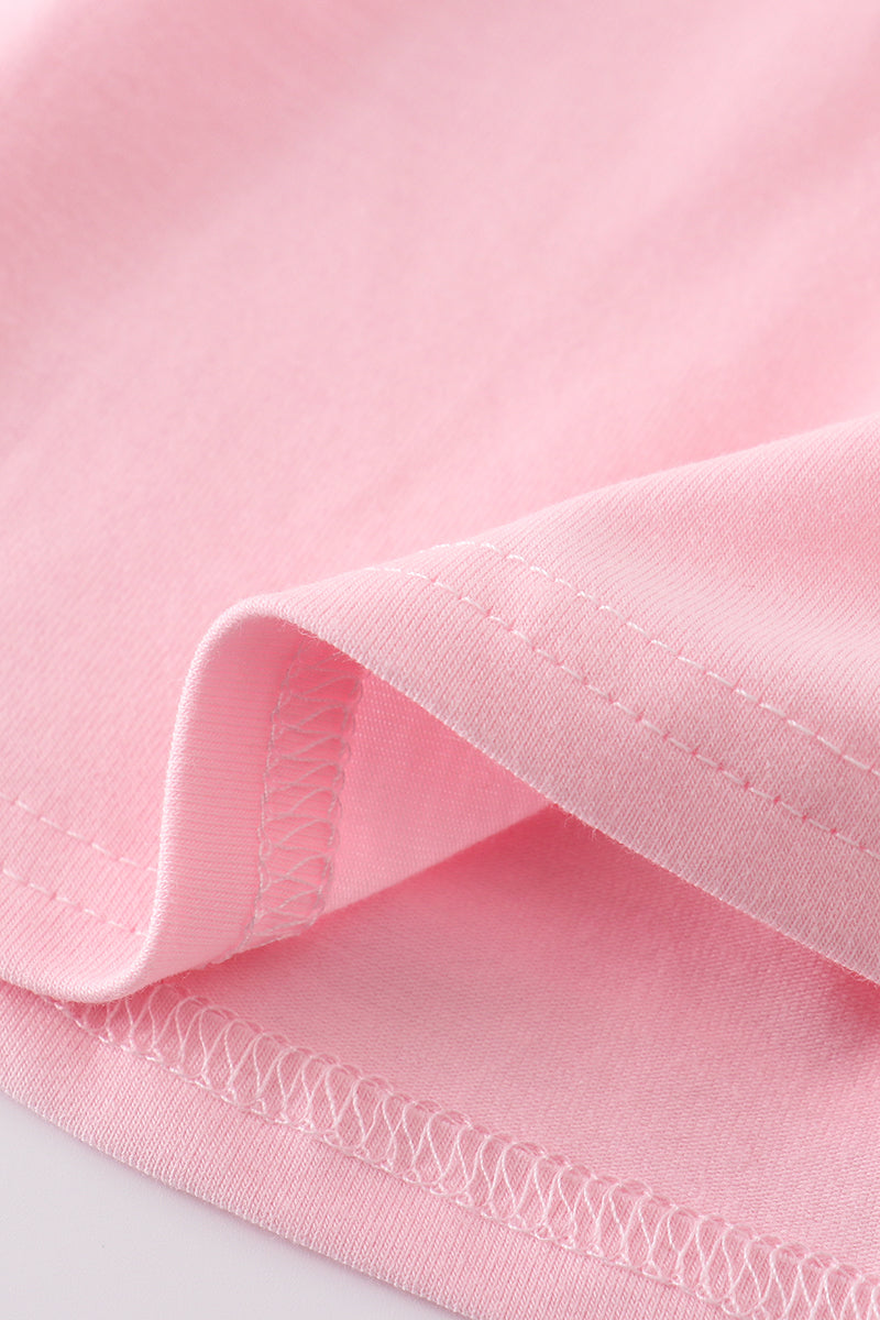 A charming pink dress with adorable puppy embroidery, perfect for little girls.