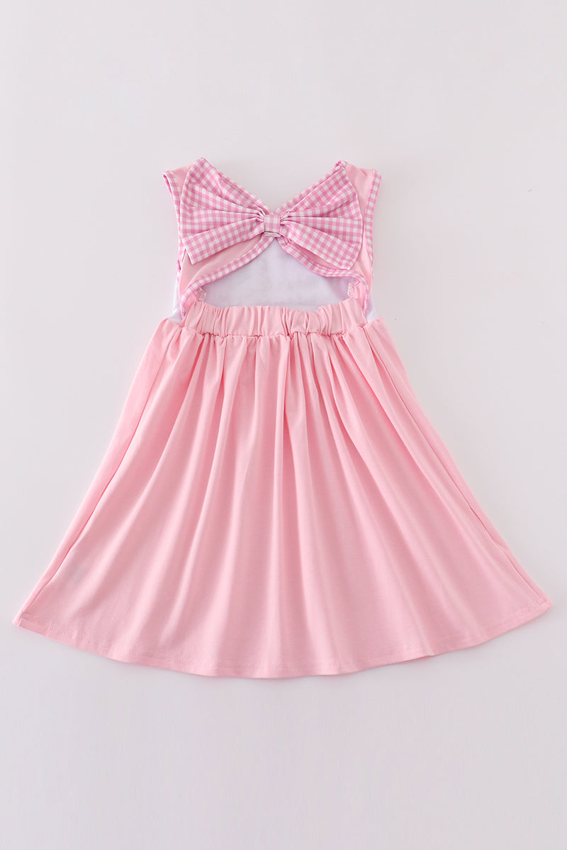 A charming pink dress with adorable puppy embroidery, perfect for little girls.