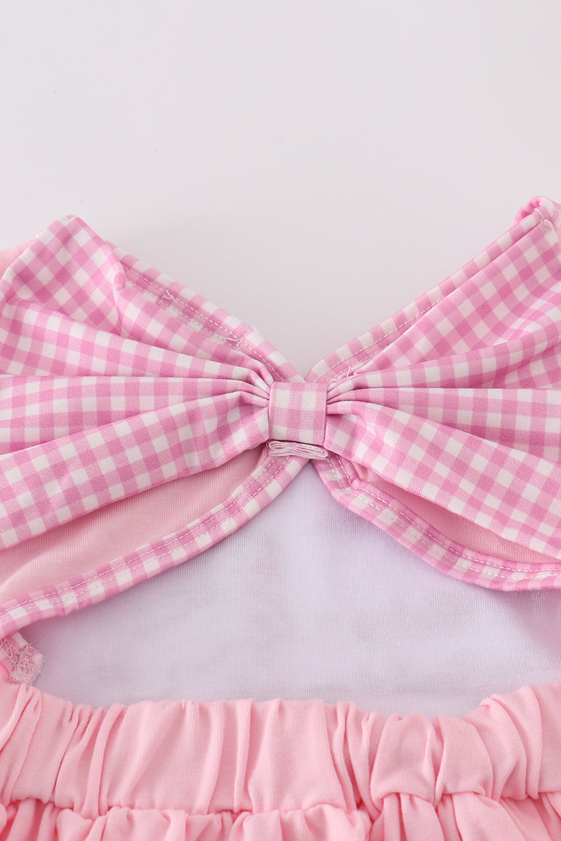 A charming pink dress with adorable puppy embroidery, perfect for little girls.