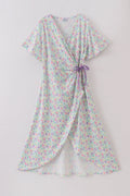 Purple floral print women’s dress with a playful, vibrant pattern, perfect for spring.