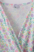 Purple floral print women’s dress with a playful, vibrant pattern, perfect for spring.
