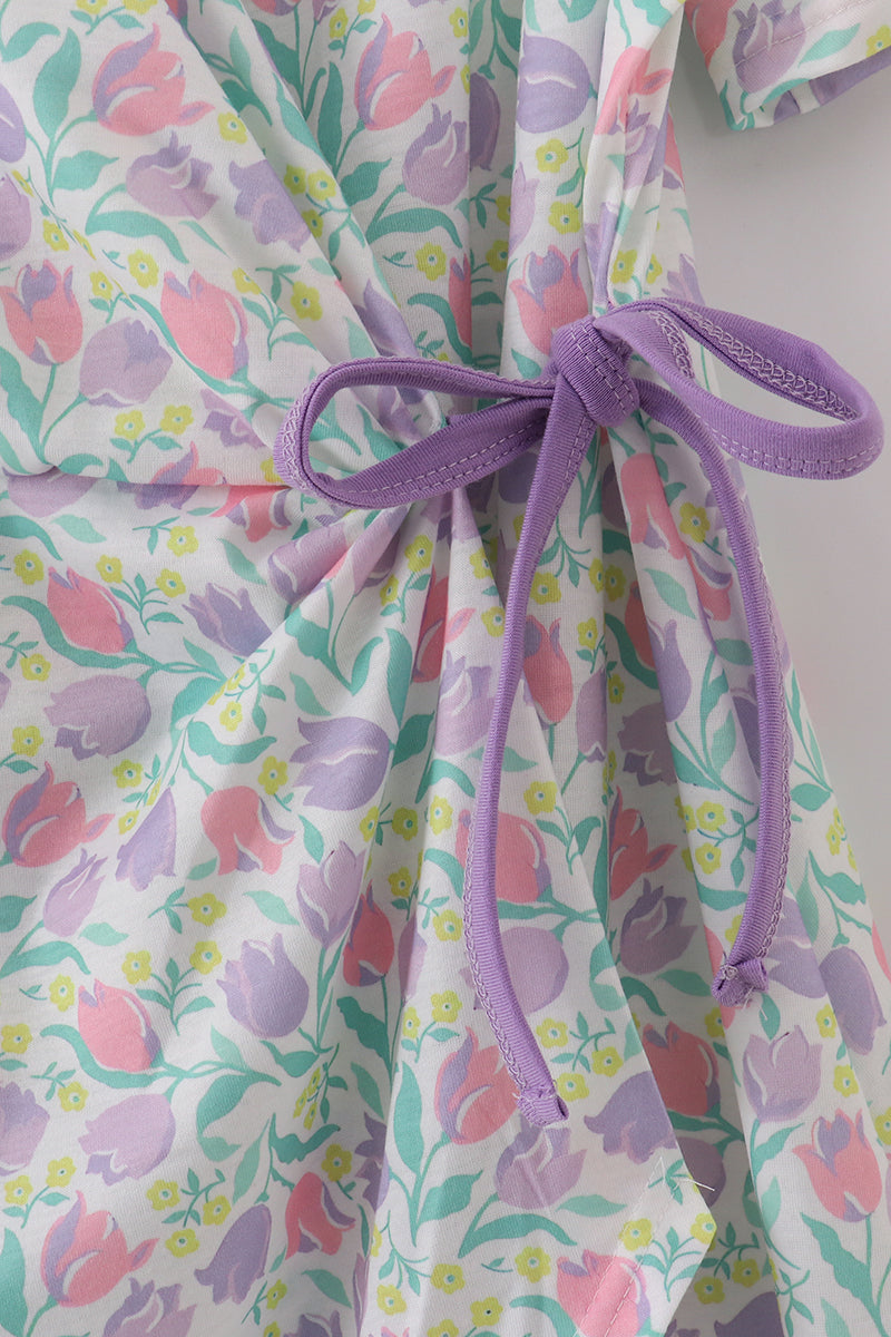 Purple floral print women’s dress with a playful, vibrant pattern, perfect for spring.
