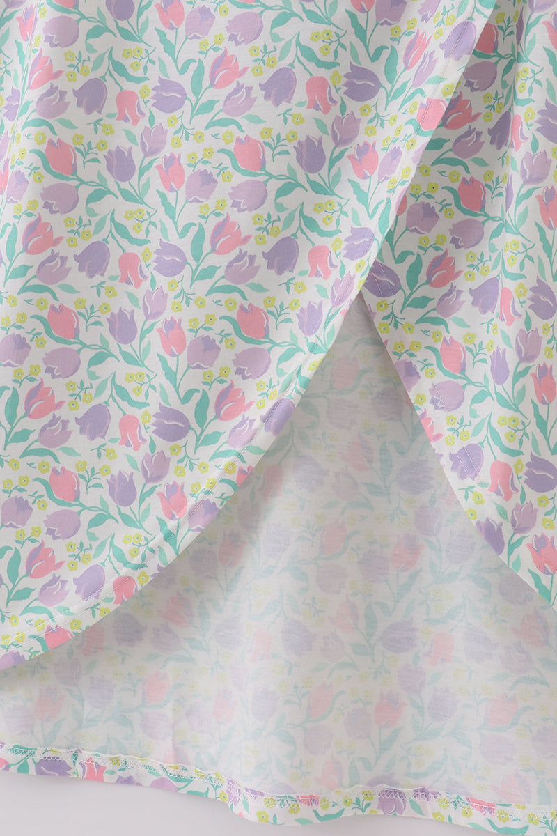 Purple floral print women’s dress with a playful, vibrant pattern, perfect for spring.