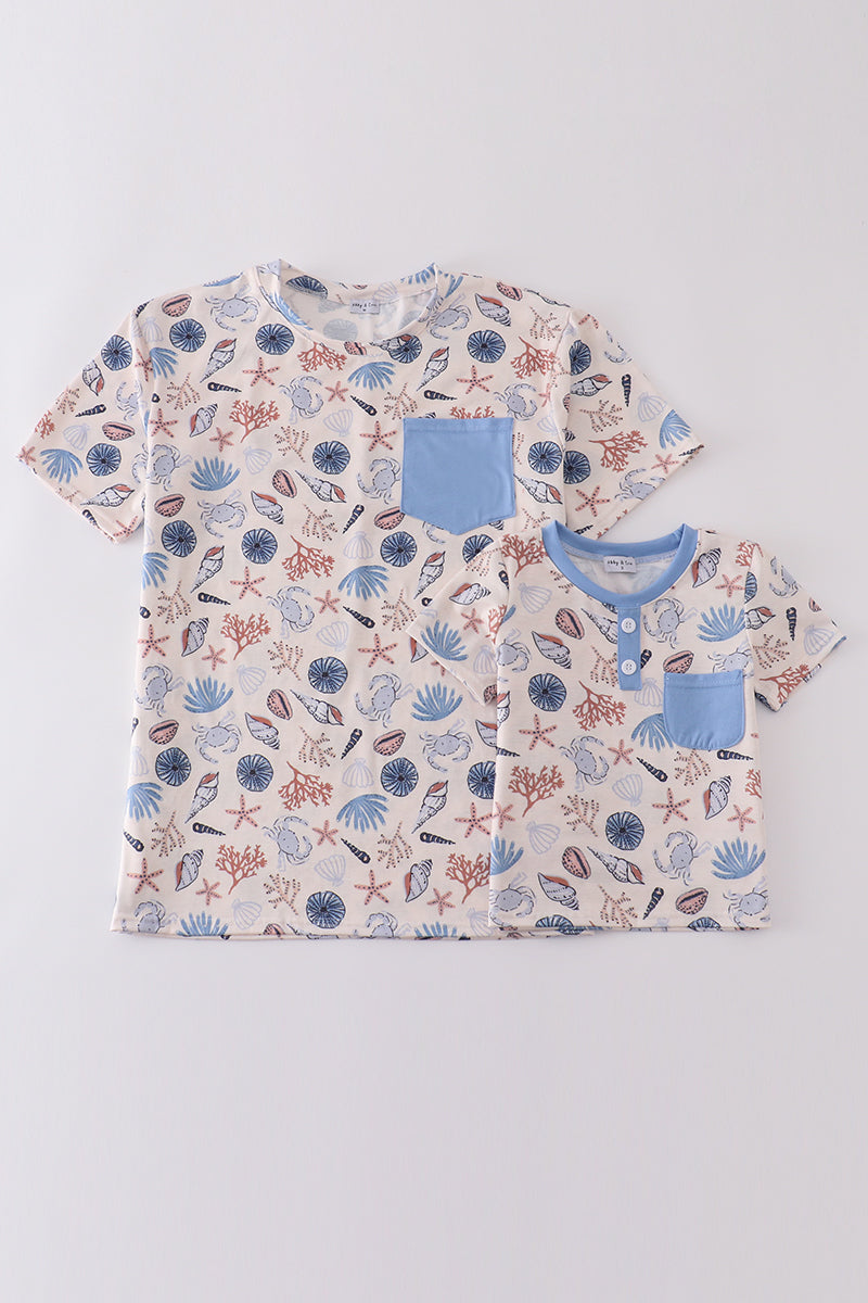 Blue ocean breeze shells print top, perfect for dad and me matching moments.