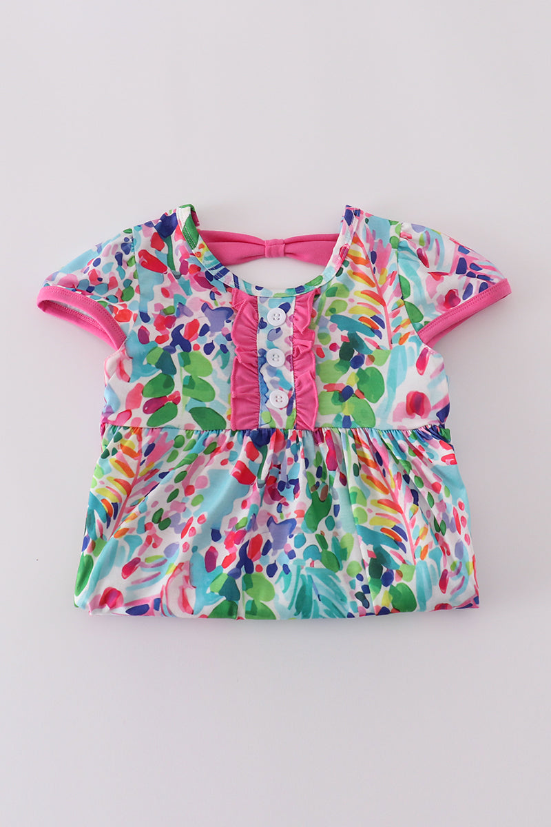A vibrant Rainbow Garden print mom-and-me dress with playful floral patterns.