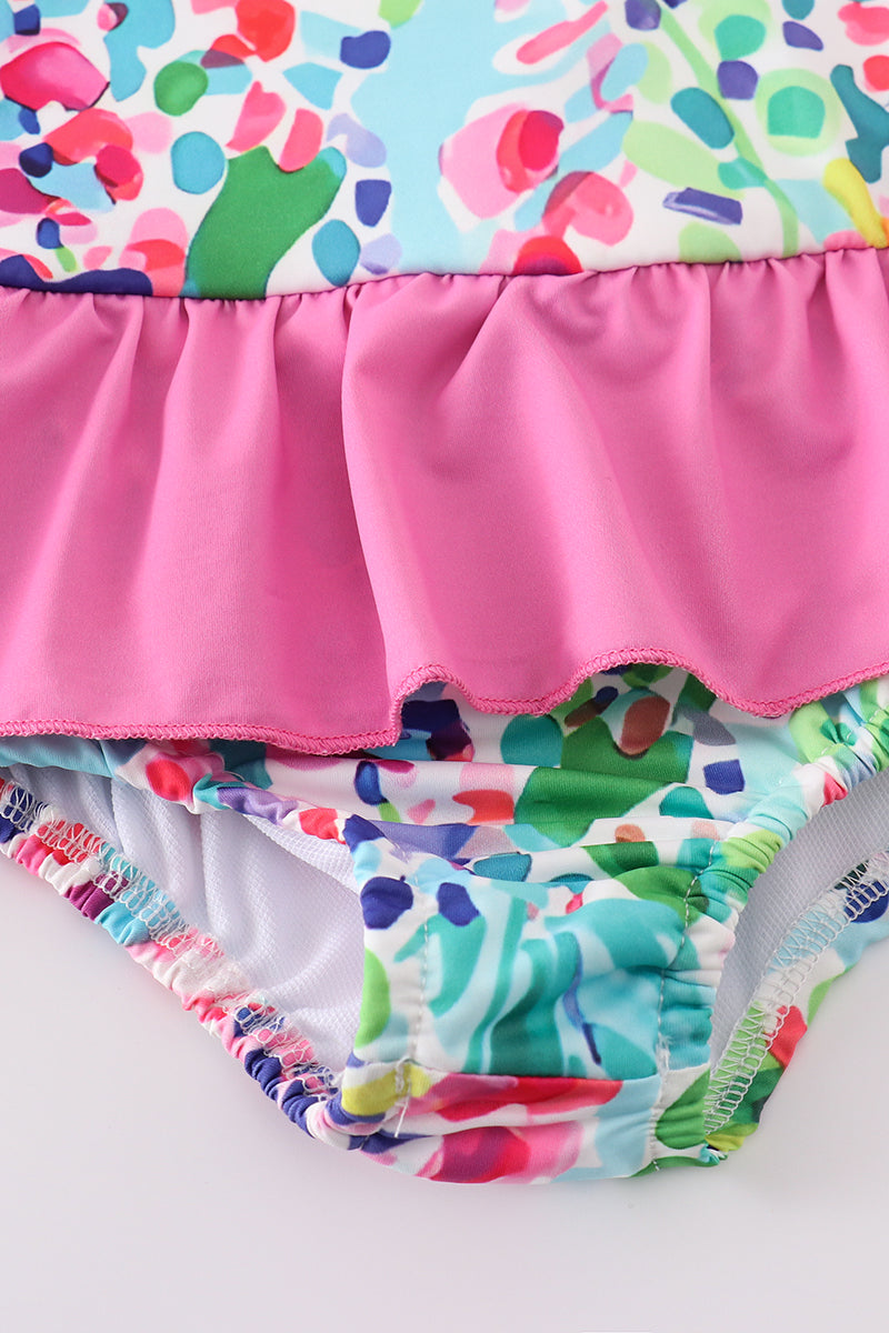 Colorful one-piece swimsuit with a vibrant rainbow garden print, perfect for summer fun.