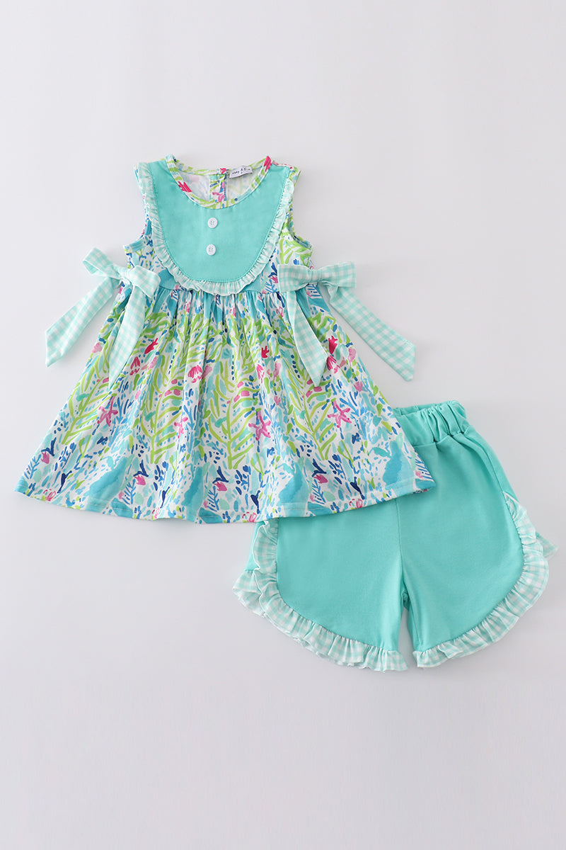 Bright, floral ruffle set for kids with ocean-inspired blooms, perfect for summer.