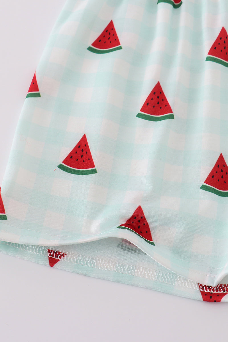 A charming red smocked set with playful watermelon embroidery, perfect for summer fun.
