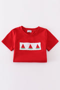 A charming red smocked set with playful watermelon embroidery, perfect for summer fun.