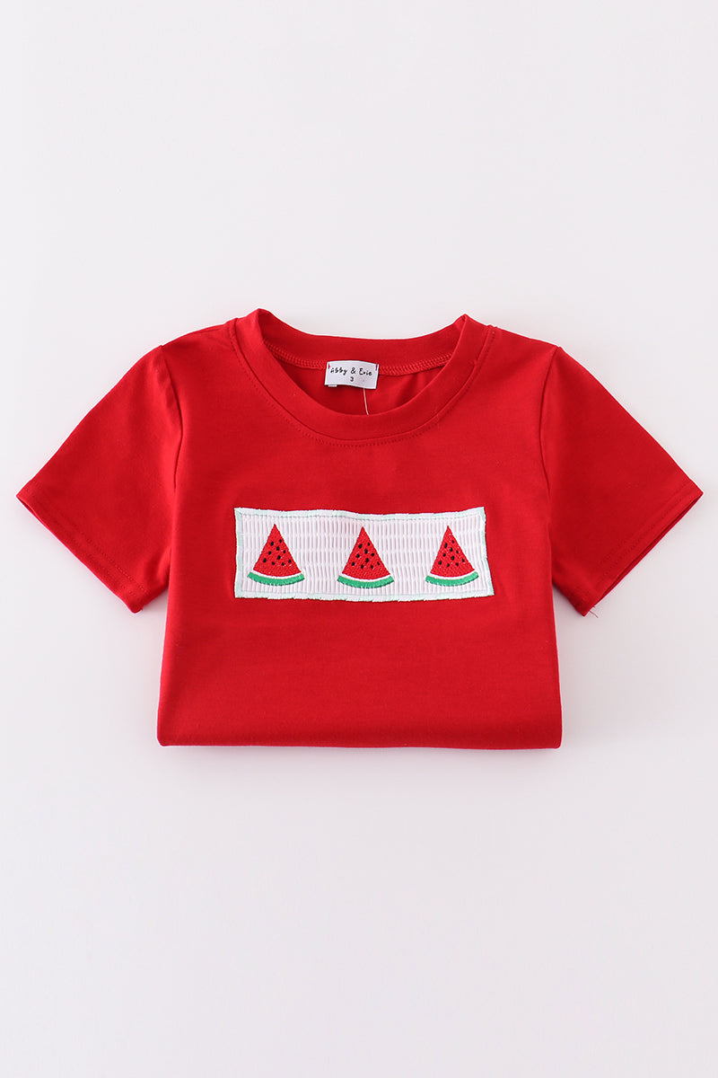 A charming red smocked set with playful watermelon embroidery, perfect for summer fun.