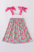 A charming pink dress with playful crab embroidery, perfect for summer fun.