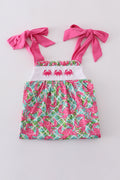 A charming pink dress with playful crab embroidery, perfect for summer fun.