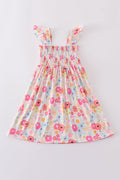 Pink floral print smocked dress with ruffled sleeves, perfect for spring outings.