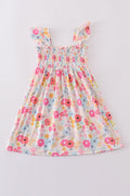 Pink floral print smocked dress with ruffled sleeves, perfect for spring outings.
