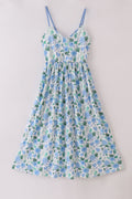 Whimsical floral mom dress with vibrant garden print, perfect for spring outings.