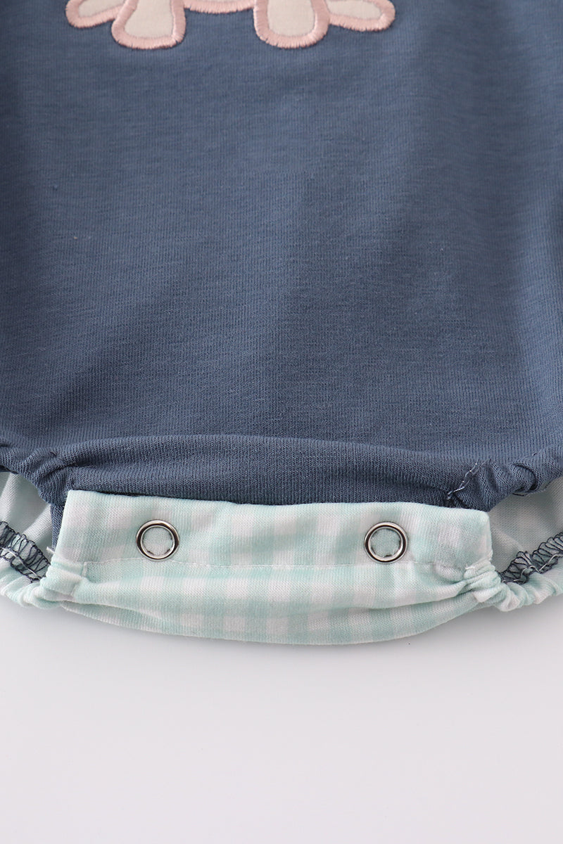 Navy bubble romper with playful puppy birthday applique, perfect for boys.