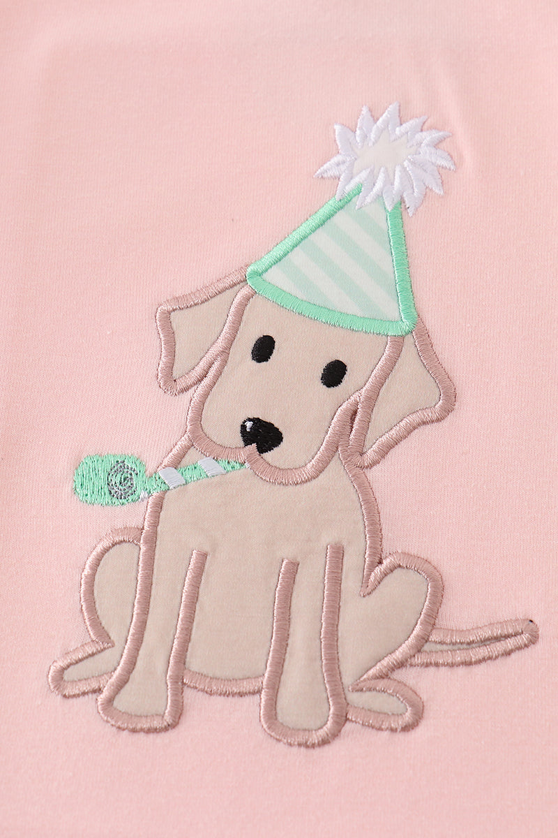 Pink puppy birthday outfit with cute applique on a soft, comfortable fabric.