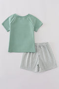 Green boy's outfit with playful chicken applique, perfect for casual playtime.