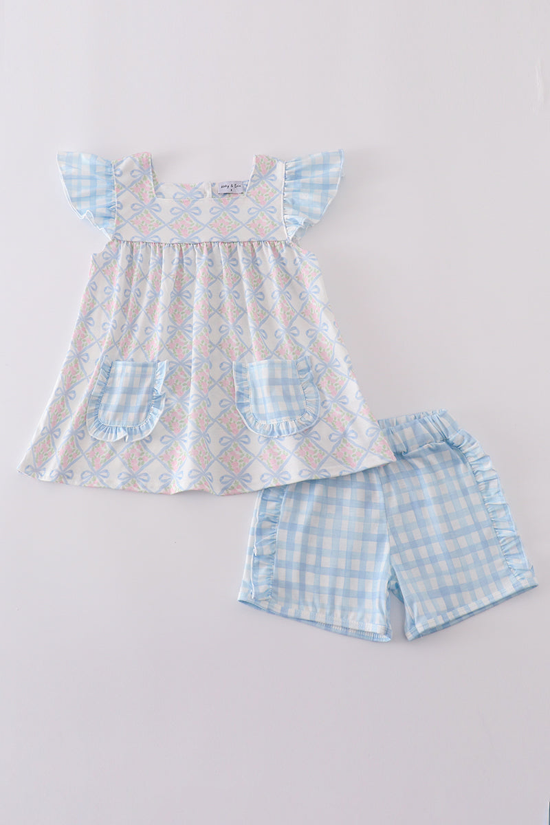 Plaid floral bow print girl set featuring vibrant patterns and playful design.