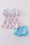 Blue petal meadow embroidery girl bloomer set with floral pattern, perfect for playtime.
