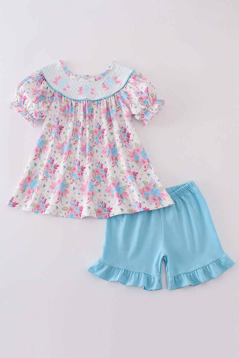 Blue petal meadow embroidery girl set: floral-patterned top and matching shorts.