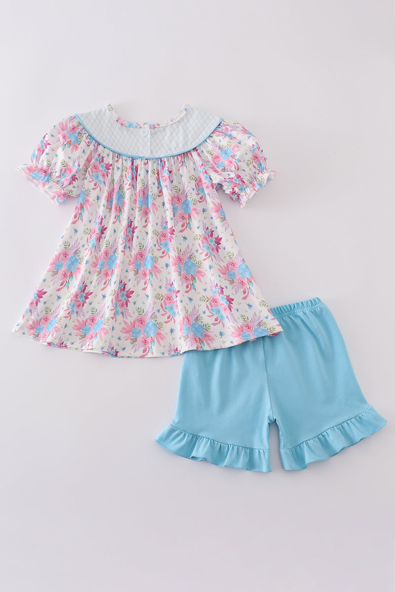 Blue petal meadow embroidery girl set: floral-patterned top and matching shorts.