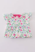 Adorable girl bubble romper with vibrant meadow print, perfect for playful adventures.