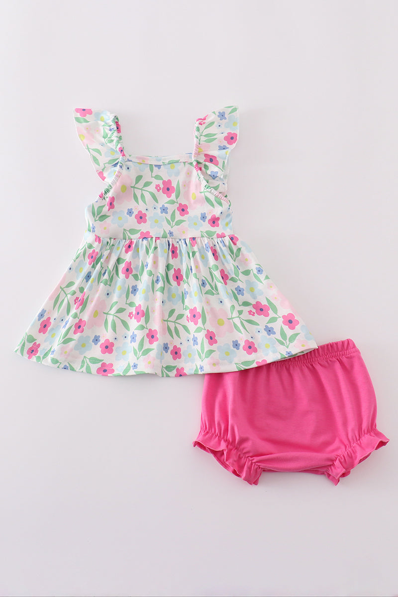 Adorable girl's bloomer set with vibrant meadow print, perfect for sunny days.