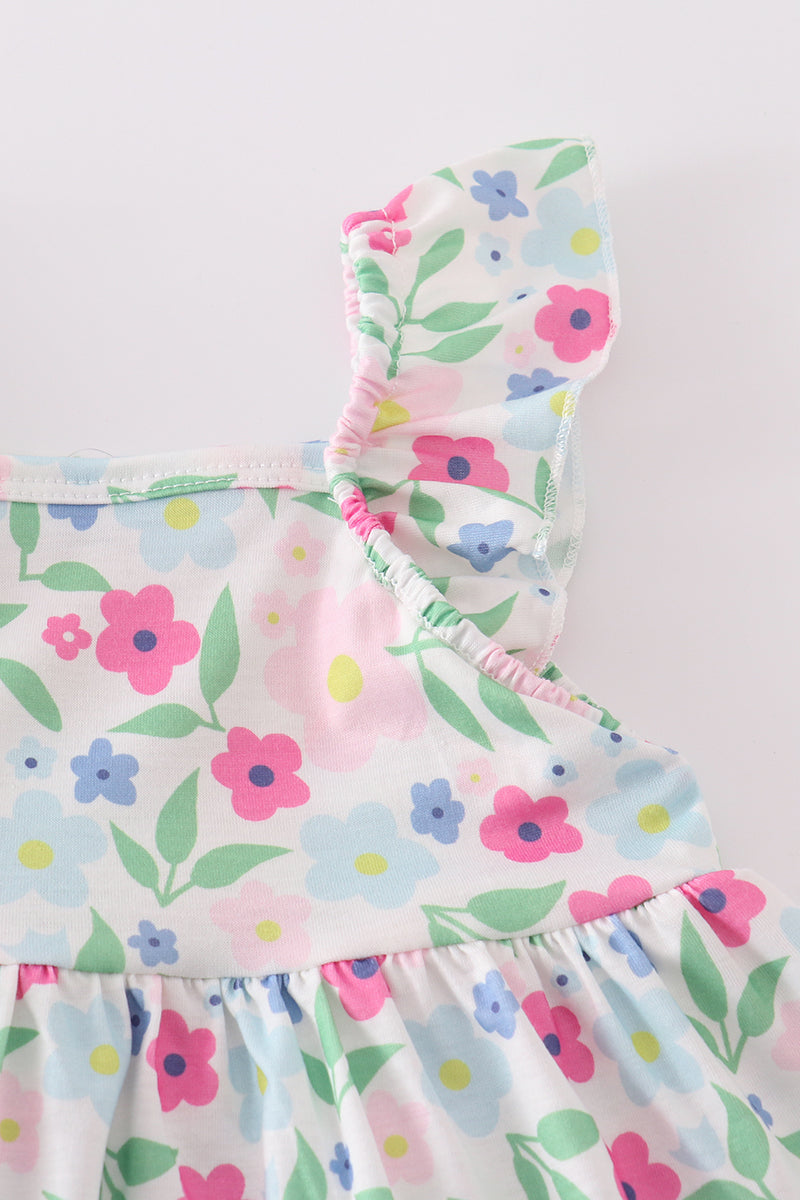 Adorable girl's bloomer set with vibrant meadow print, perfect for sunny days.