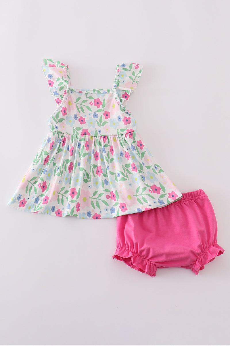 Adorable girl's bloomer set with vibrant meadow print, perfect for sunny days.