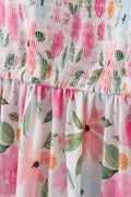 Floral smocked mom dress with pastel blossoms, perfect for spring outings.