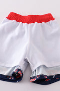 Matching navy swim trunks with Atlanta Braves logo for dad and son.