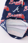 Matching navy swim trunks with Atlanta Braves logo for dad and son.