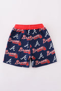Matching navy swim trunks with Atlanta Braves logo for dad and son.