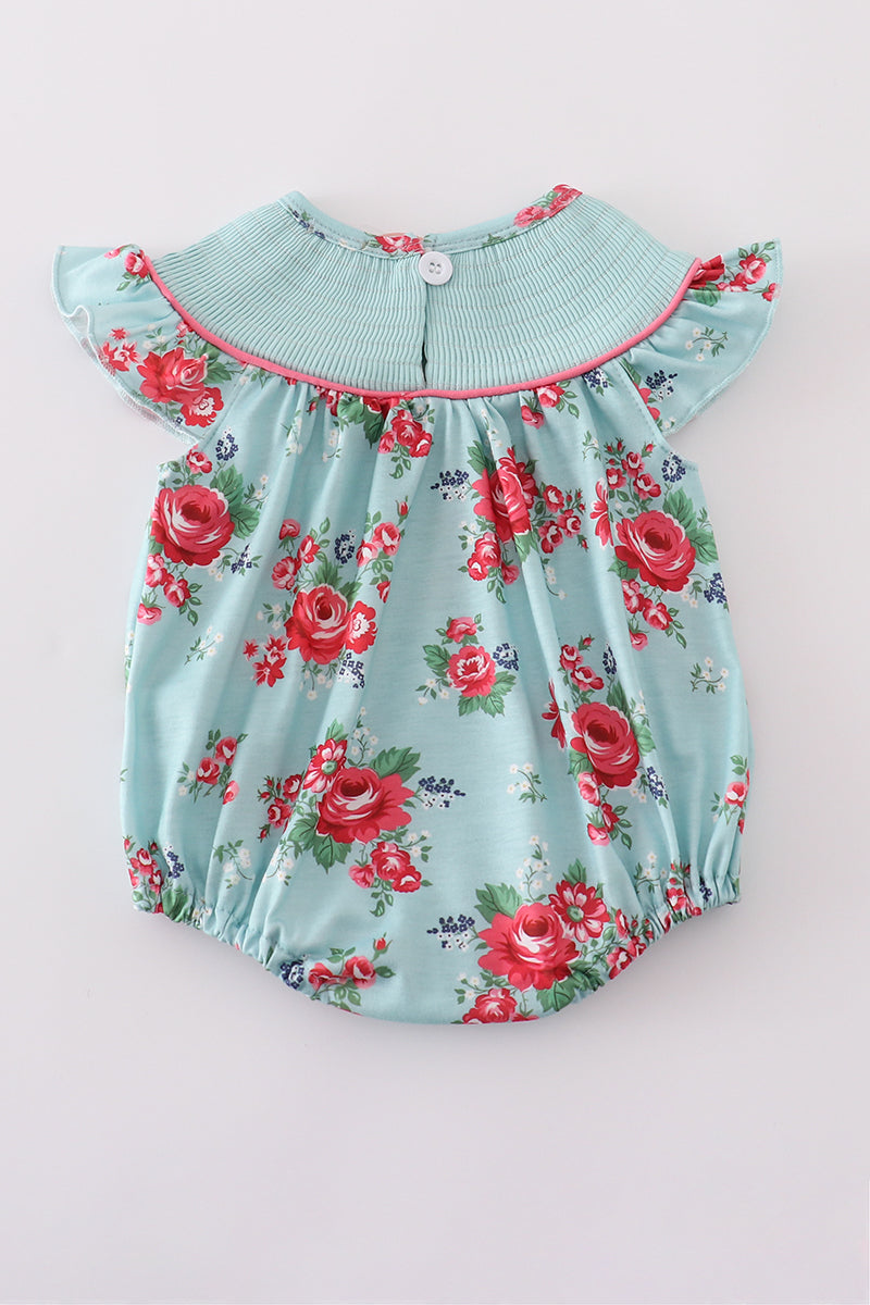 Smocked girl bubble with charming rosebud print, perfect for playful summer days.