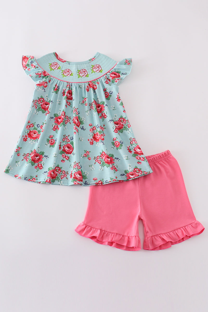 Smocked girl set with a charming rosebud print, perfect for spring outings.