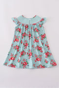 Smocked girl dress with rosebud print, perfect for a spring celebration.