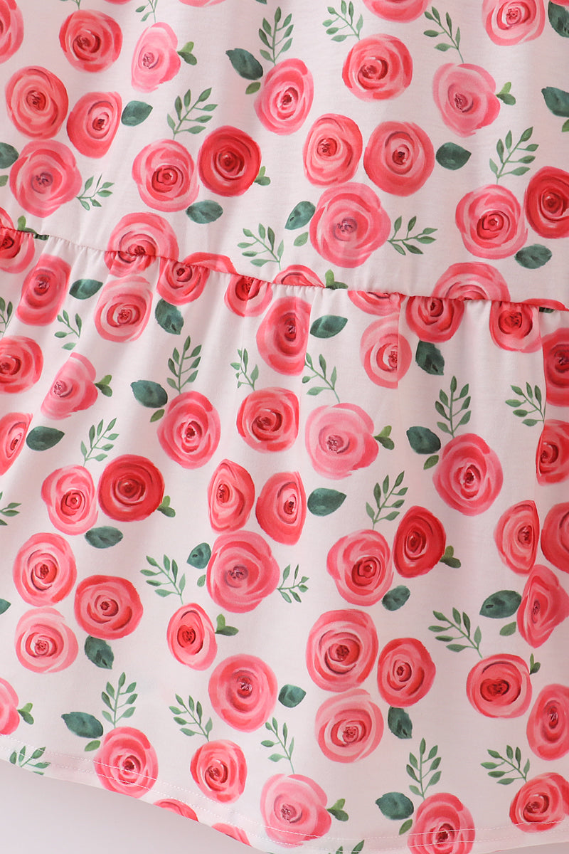 Pink floral print mom dress with playful blooms, perfect for spring outings.