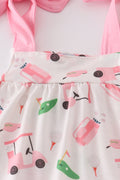 Adorable pink bloomer set with playful golf-themed print, perfect for toddlers.