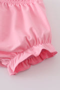 Adorable pink bloomer set with playful golf-themed print, perfect for toddlers.