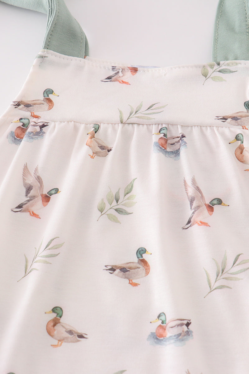 Adorable green bubble romper with playful duck print, perfect for toddlers.