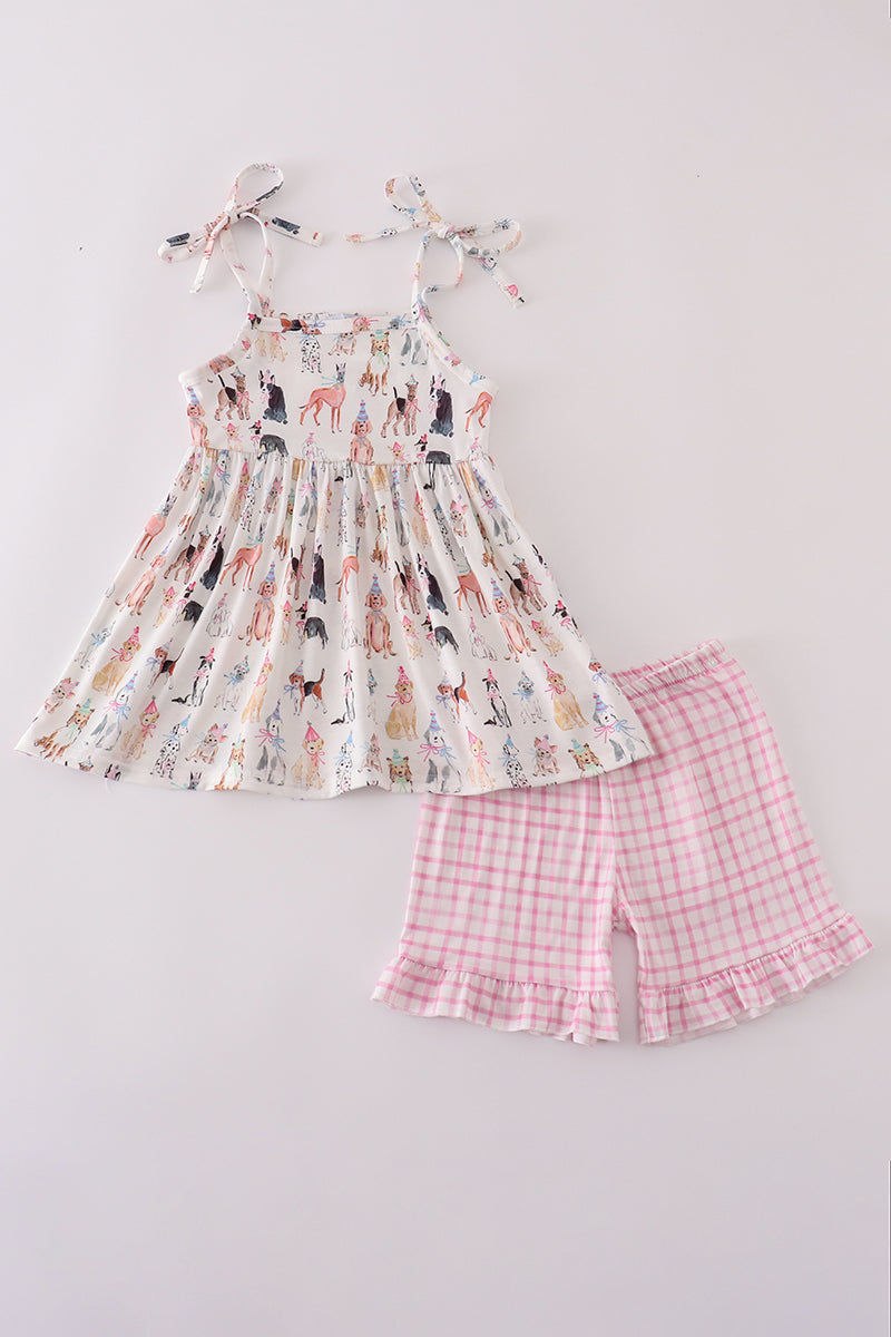 Pink party puppy print set featuring a playful dog pattern on cozy children's pajamas.