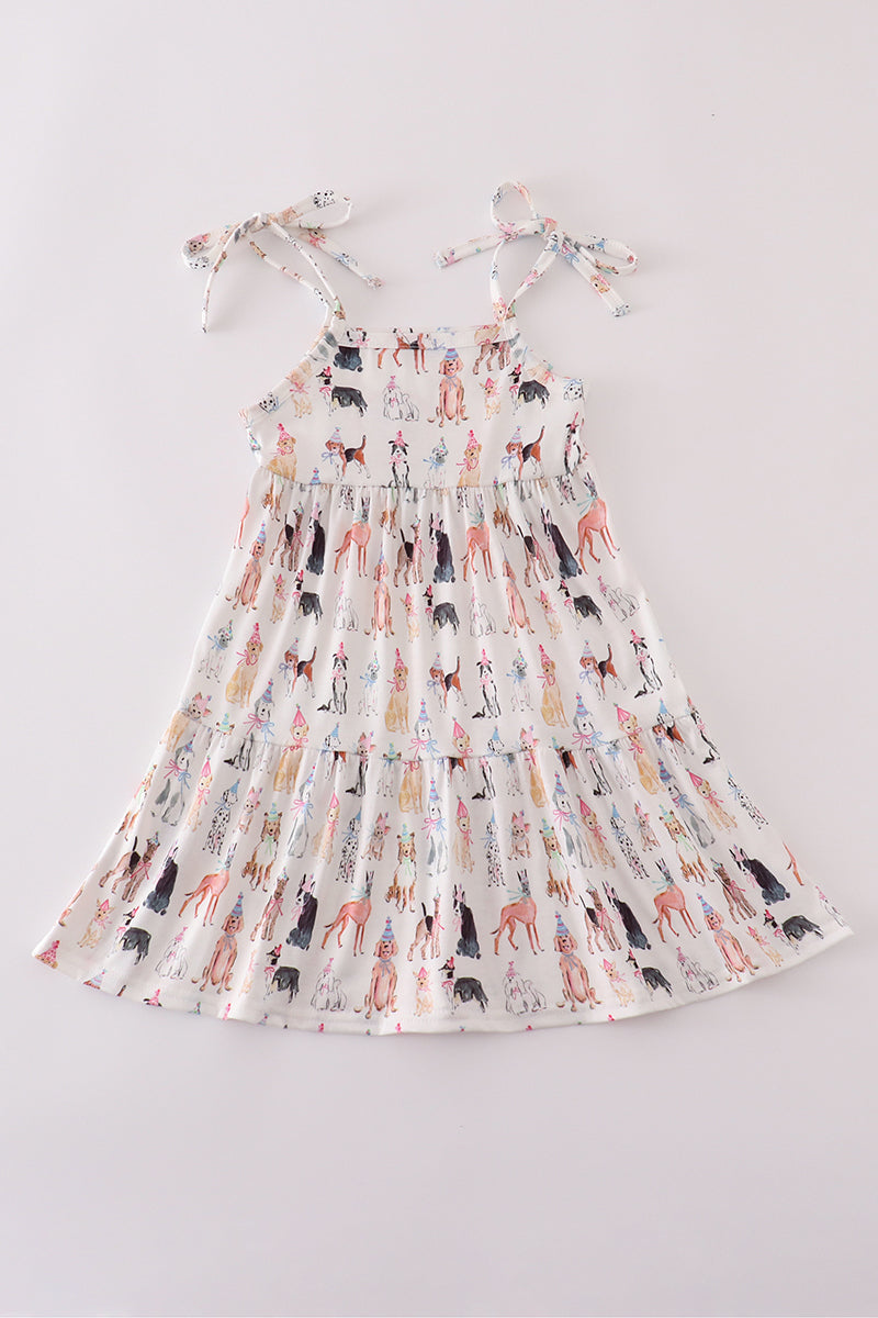 A cute pink dress with playful puppy prints, perfect for parties.