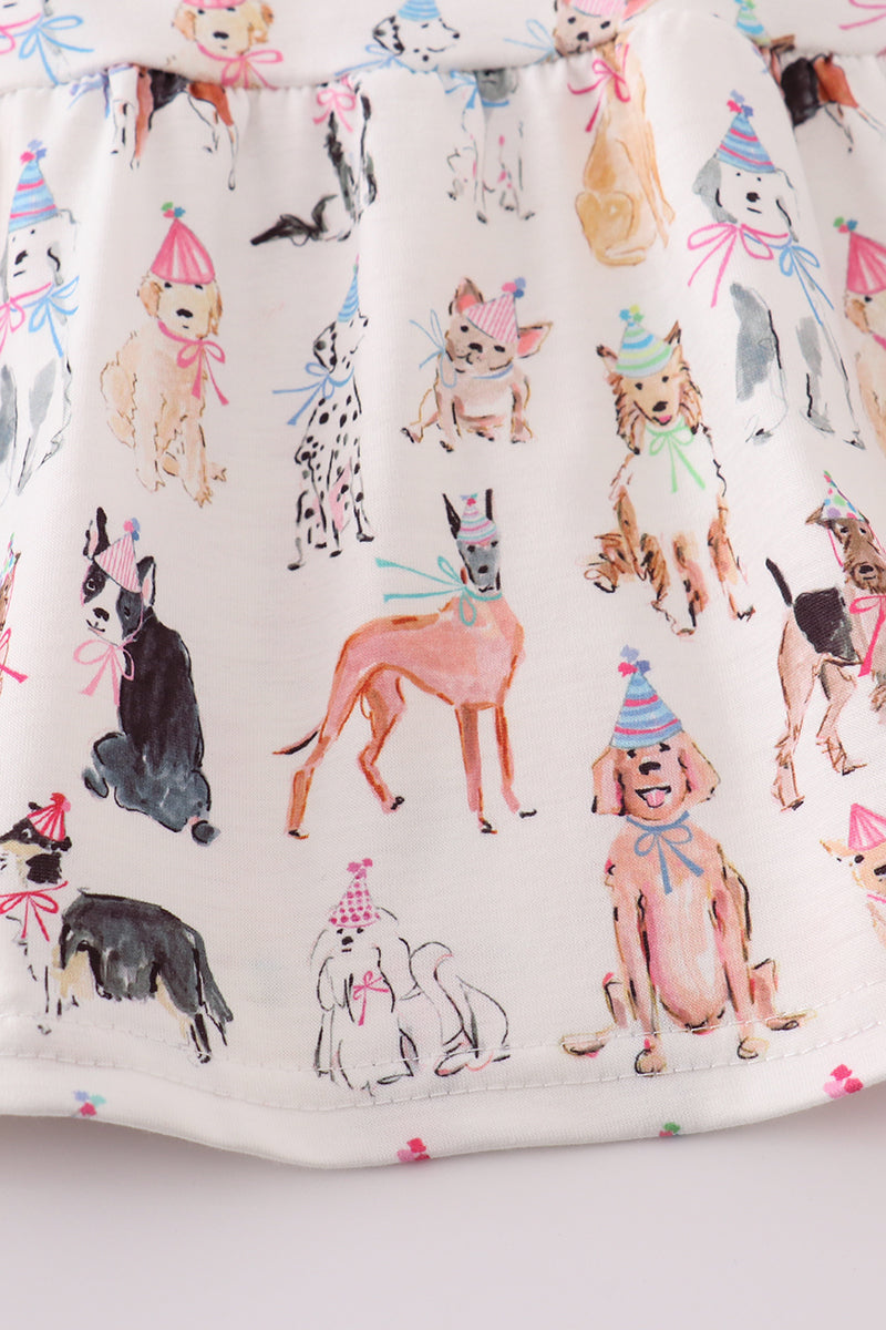 A cute pink dress with playful puppy prints, perfect for parties.