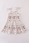 A cute pink dress with playful puppy prints, perfect for parties.