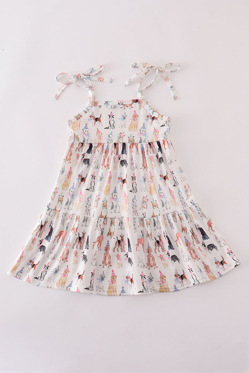 A cute pink dress with playful puppy prints, perfect for parties.