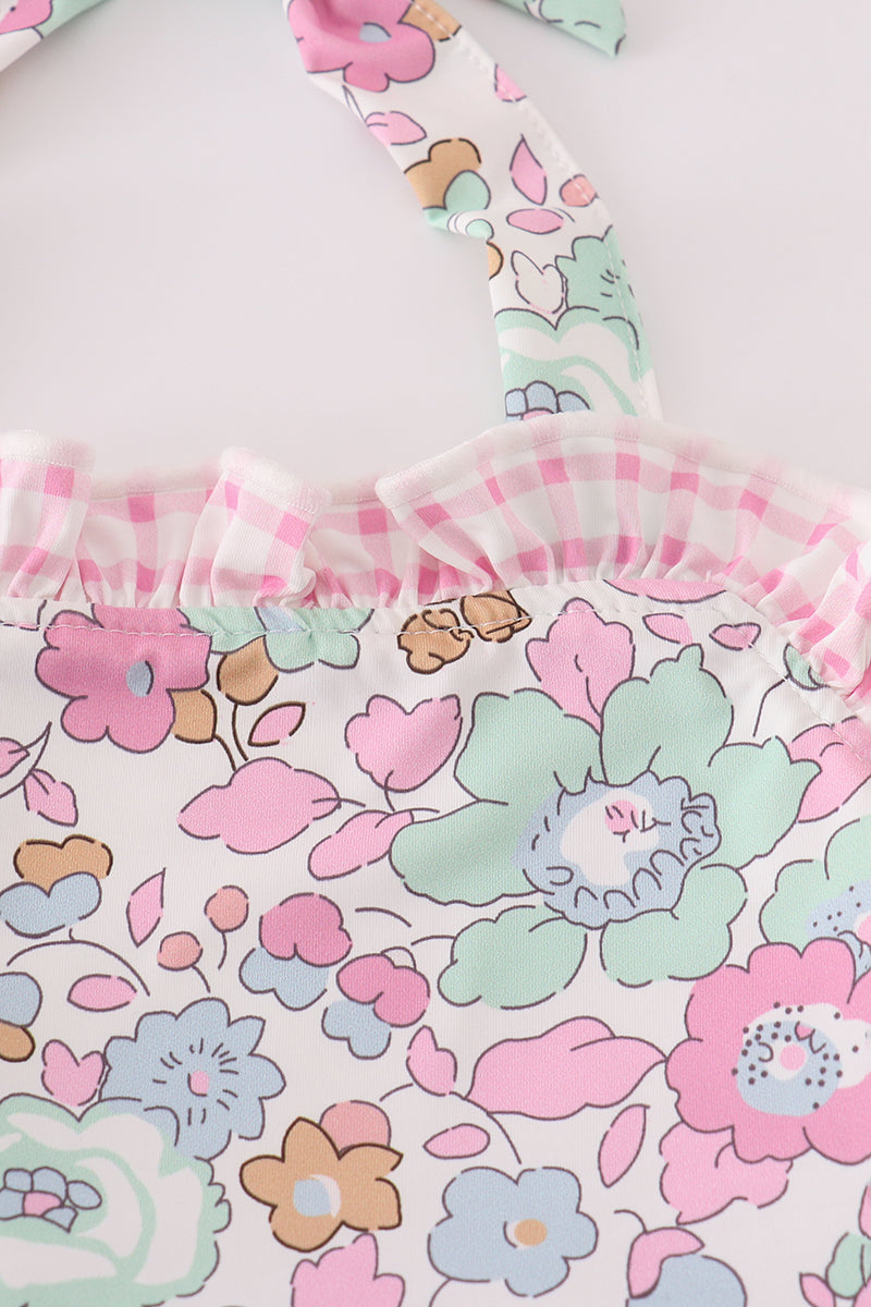Pink floral one-piece swimsuit for kids, featuring cheerful flower patterns.