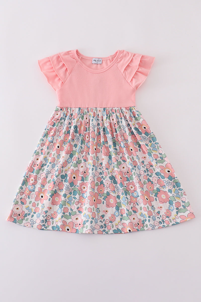 Pink summer floral print ruffle dress with playful flowers and soft, flowing fabric.