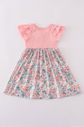 Pink summer floral print ruffle dress with playful flowers and soft, flowing fabric.